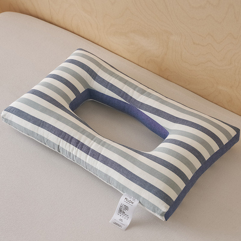 Contoured cotton side sleeper pillow with a hollow ear relief center and neck ridge, striped