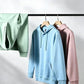 Light blue, mint and mauve hoodies hanging on a clothes rail, colors not among the available options