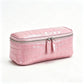 Pink crocodile pattern genuine leather cosmetic bag with silver double zipper, three quarter view