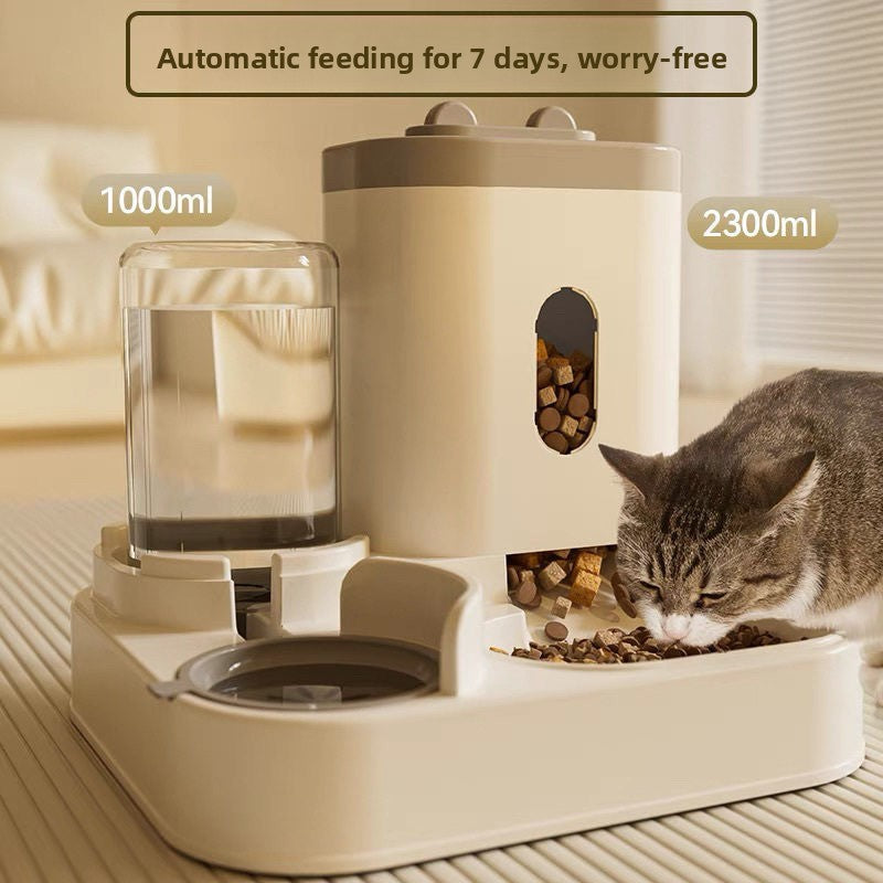White gravity pet feeder with tall food hopper and clear water bottle beside the twin bowl base