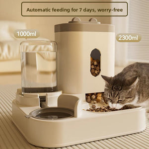White gravity pet feeder with tall food hopper and clear water bottle beside the twin bowl base
