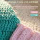 Close up of the chunky teal and pink crochet stitch of the baby mermaid costume set