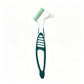 Green double headed denture brush with a white PP handle and green TPE grip on a white background