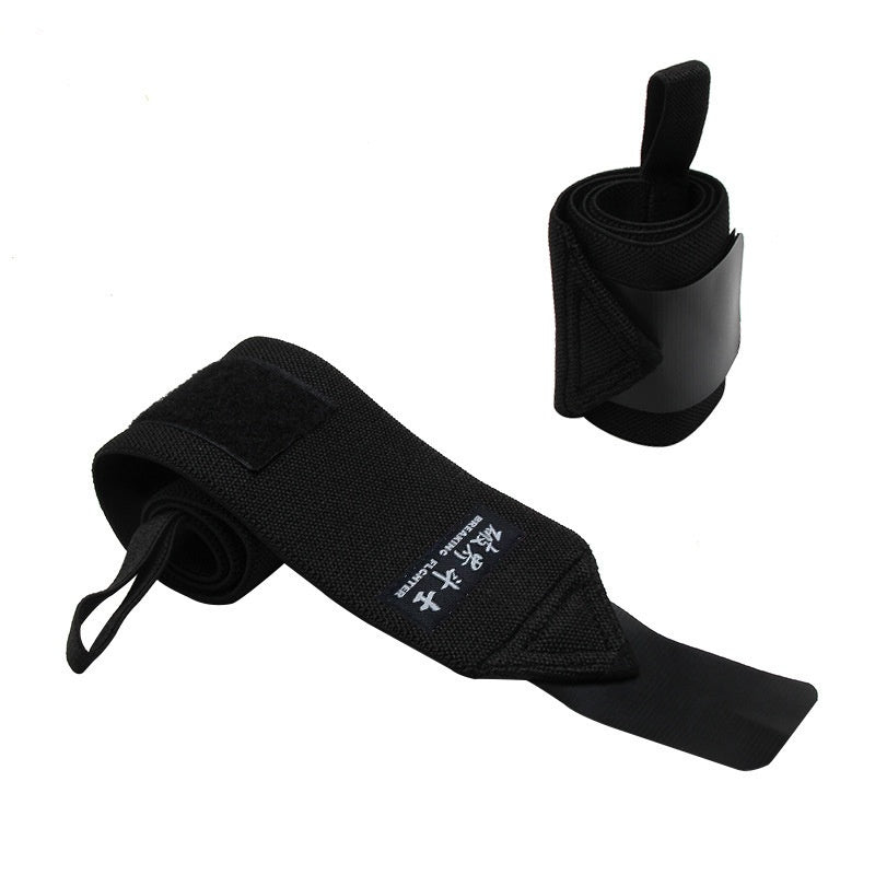 Plain black elastic wrist wrap pair on white, thumb loop and hook and loop tab