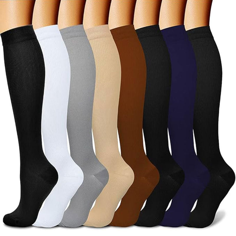 Patterned compression socks lined up to show calf coverage and knee-high length