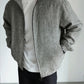 Close-up of the woven linen texture and slub on the stand collar jacket fabric