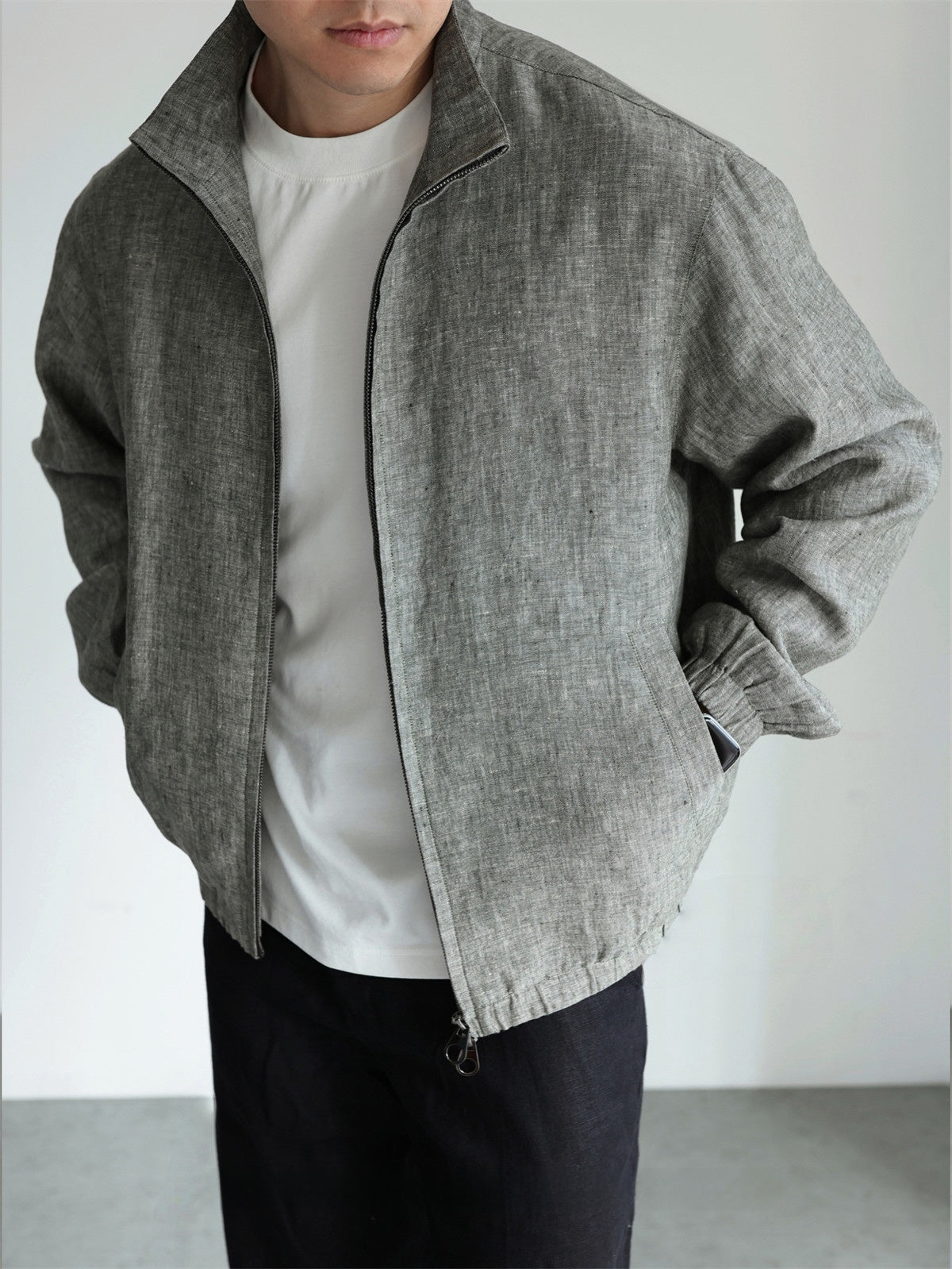 Close-up of the woven linen texture and slub on the stand collar jacket fabric