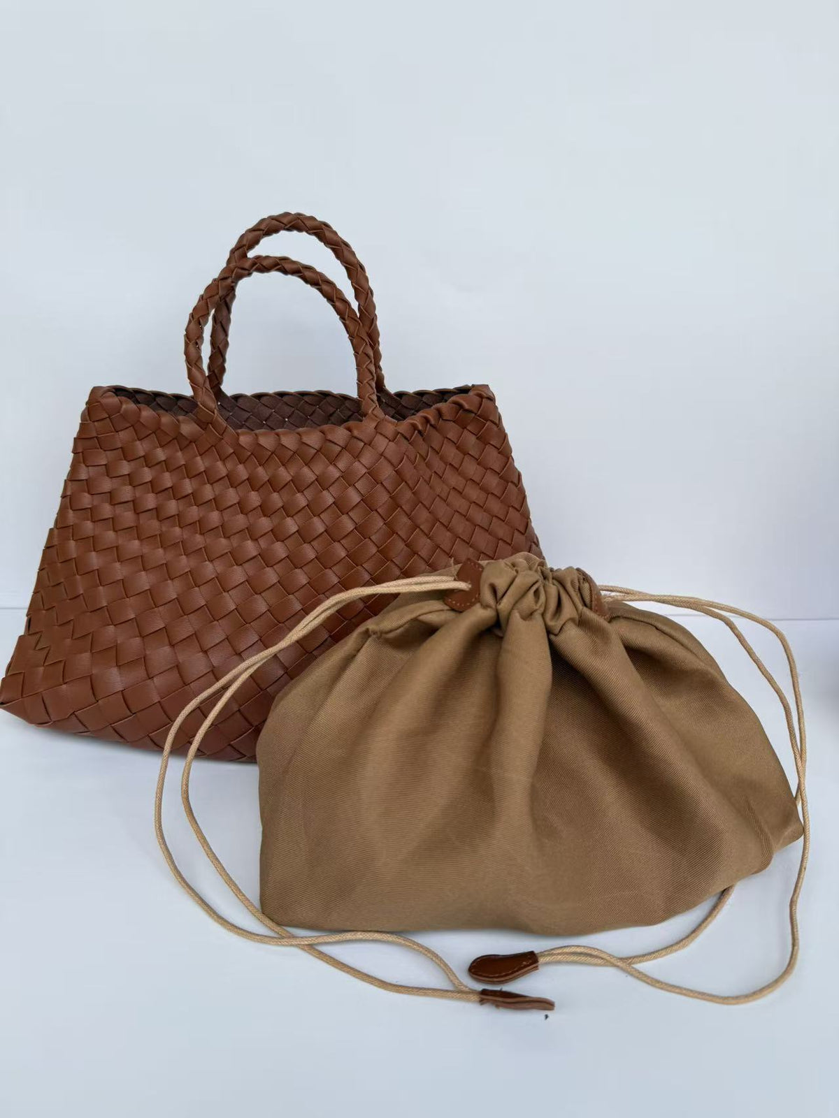 Light brown woven PU handbag with braided handles and drawstring pouch, Light brown variant