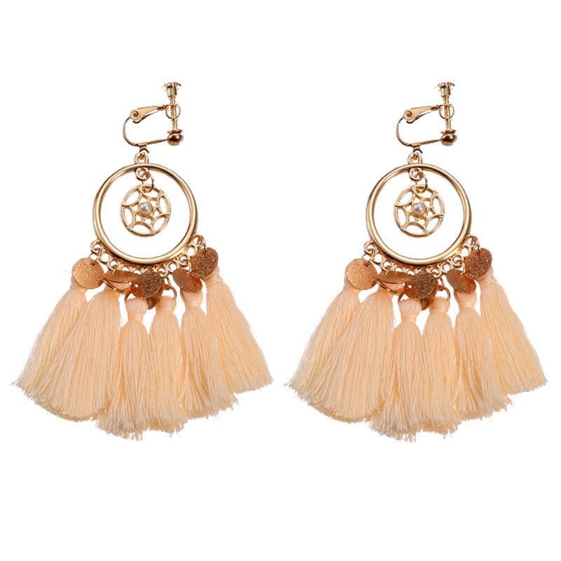 Boho vintage clip-on drop earrings with fringe and bead accents, zinc alloy build, studio image on white background