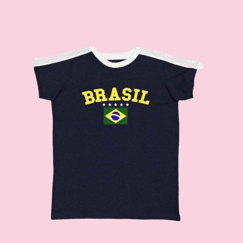 Navy Brasil baby tee with white ringer neck and yellow lettering on pink