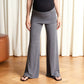 Coral wide leg palazzo pants draping in soft folds, front