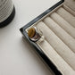 Tiger eye stone ring resting in a jewellery tray