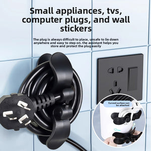 Black cord winder stuck to a toaster holding the wrapped power cord and plug