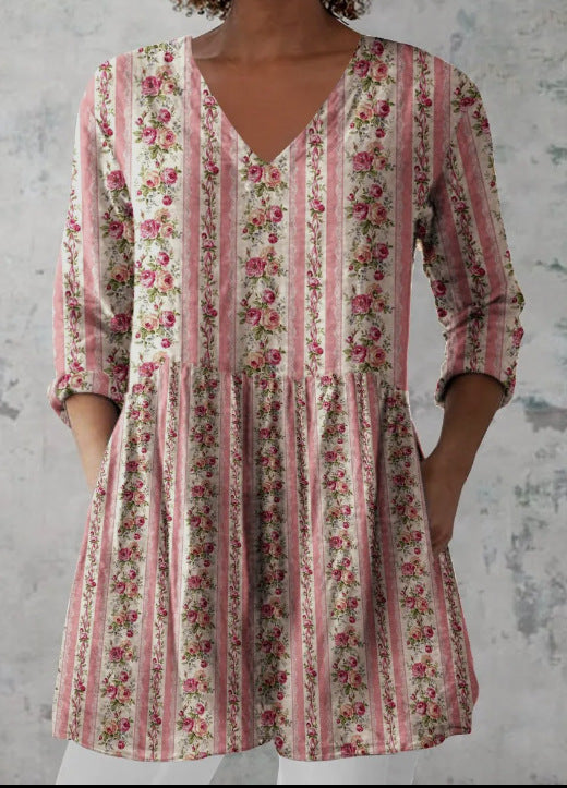 Loose fit printed V neck tunic against a plain studio wall