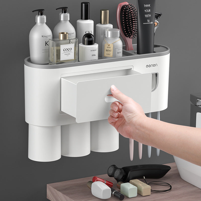 Pull out drawer of the bathroom organizer open above the rinse cups
