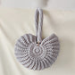 Handmade Woven Conch Shell Coin Purse | off-white background hero