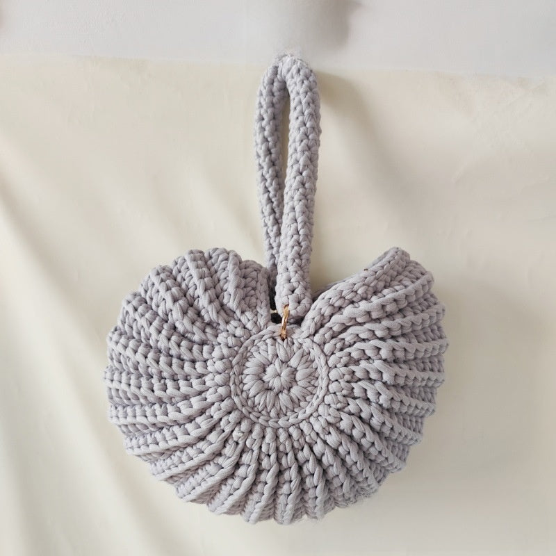 Handmade Woven Conch Shell Coin Purse | off-white background hero