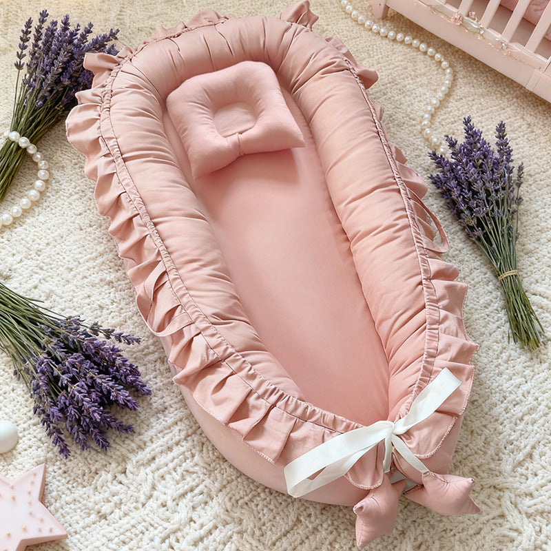Four color options of the ruffle trim cotton baby nest laid out together