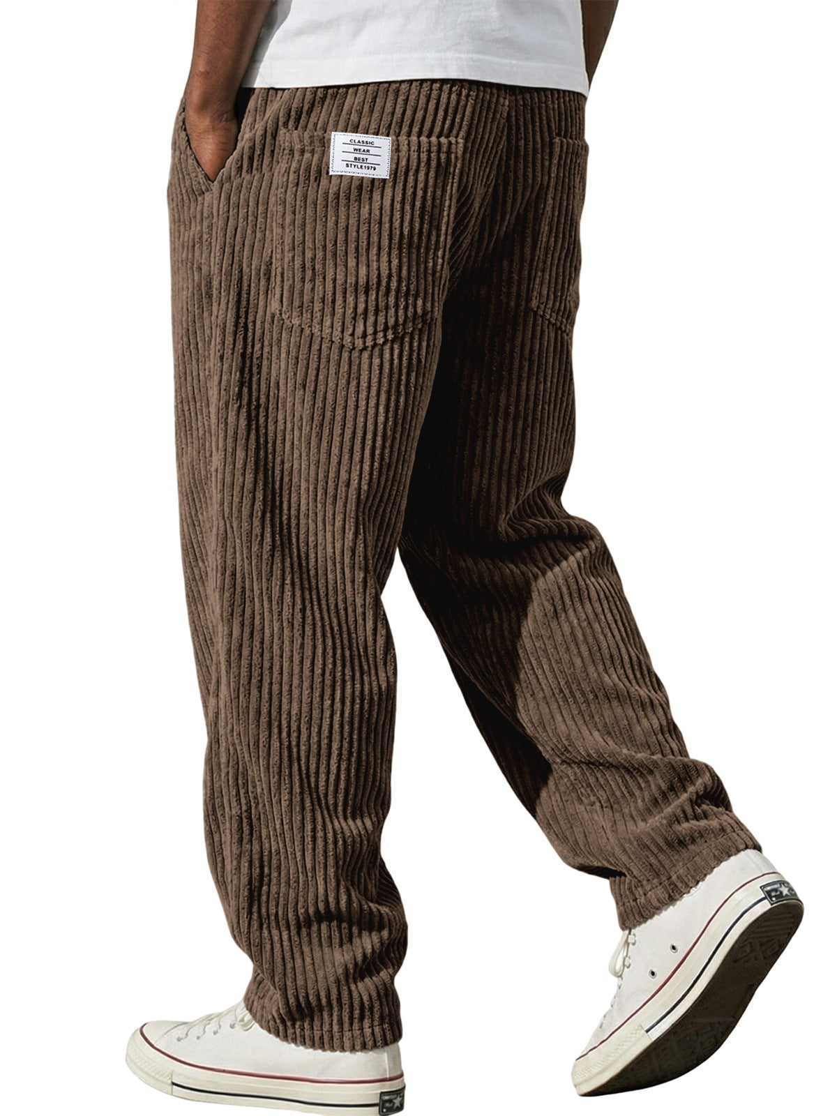 Back view of the wide wale corduroy trousers showing patch pockets and a woven flag label