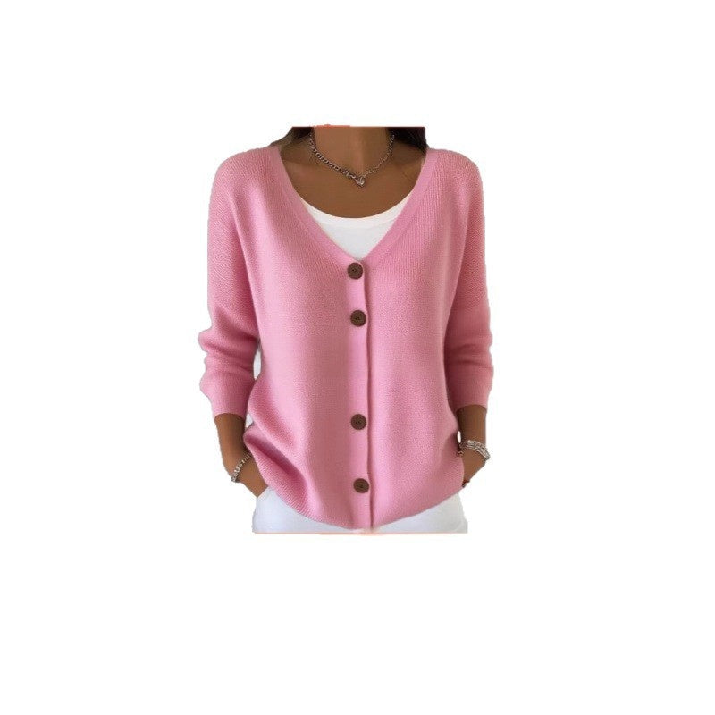 Women's V neck button front knit cardigan shown open over a white top with wooden buttons
