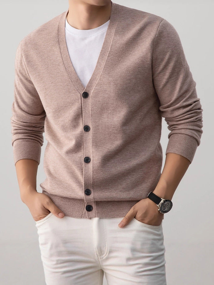 Camel mens V neck knit cardigan with a button front worn over a white tee by a model