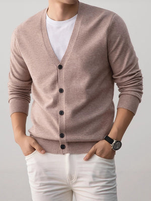 Camel mens V neck knit cardigan with a button front worn over a white tee by a model