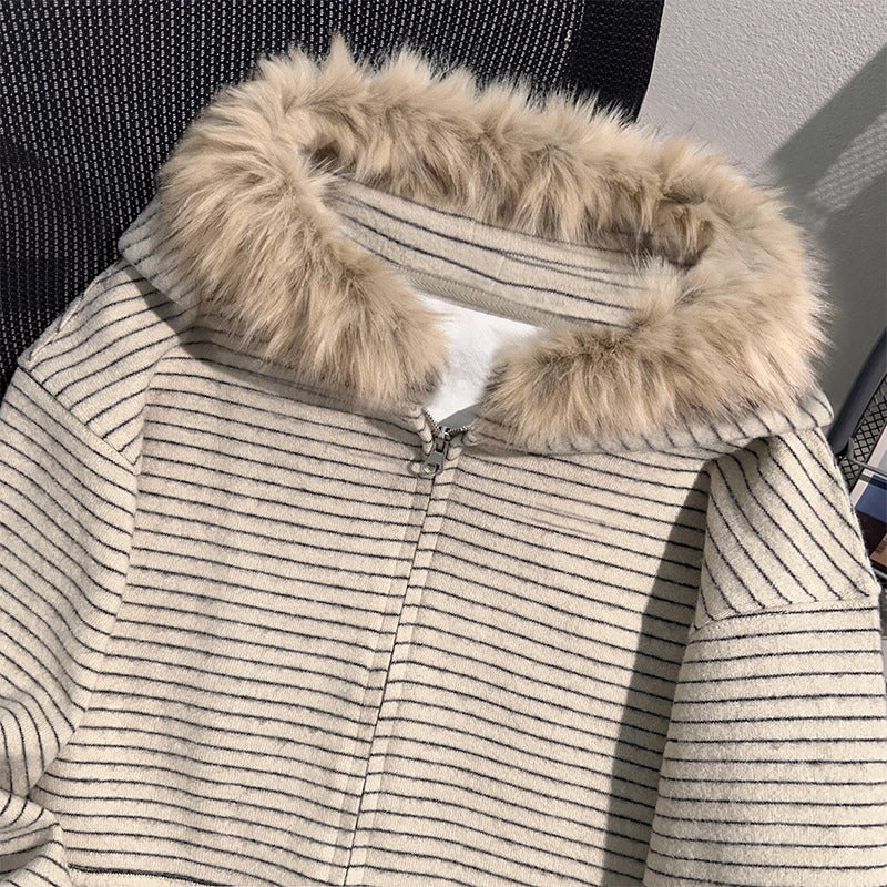 Close view of the cream striped knit and the vegan fur trimmed hood with white plush lining and the zip