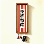 Tall vertical wood wall frame with a four photo strip and two key hooks, a format shown but not offered in the options