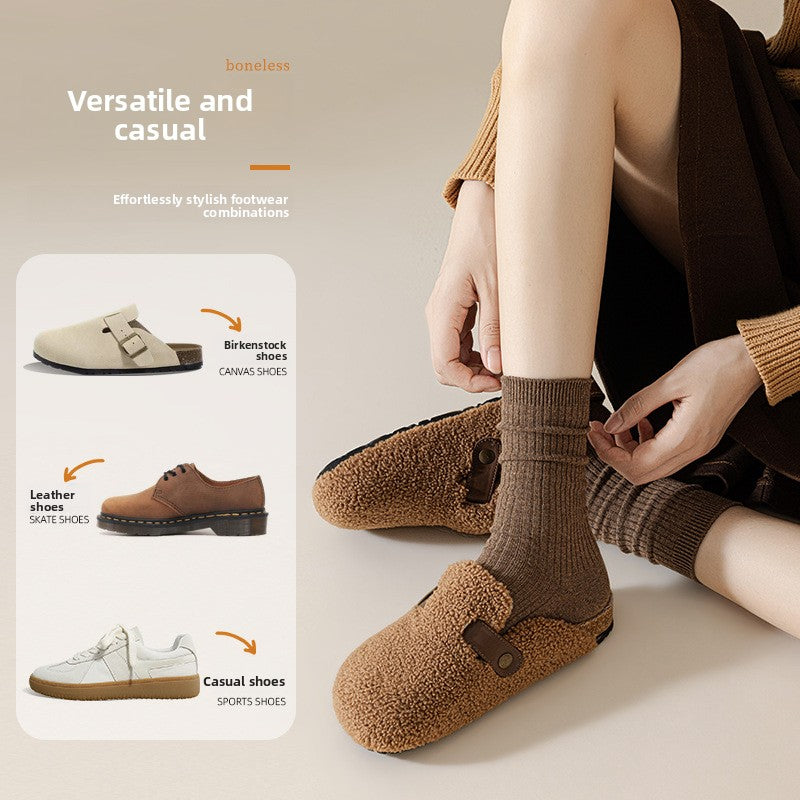 Woman adjusting brown ribbed socks over a clog, beside leather shoes and sneakers shown as styling
