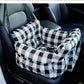 Padded car seat pet bed with raised bolster walls, carry handles and an inner clip showing the inner clip on its strap