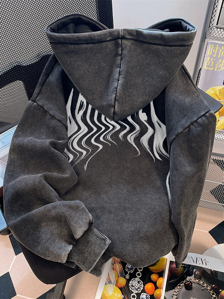 Back view of the washed black hoodie showing the wavy flame print