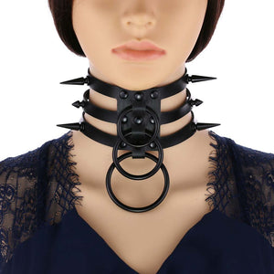 Black PU leather spike choker with double O-rings worn on a mannequin neck, front view