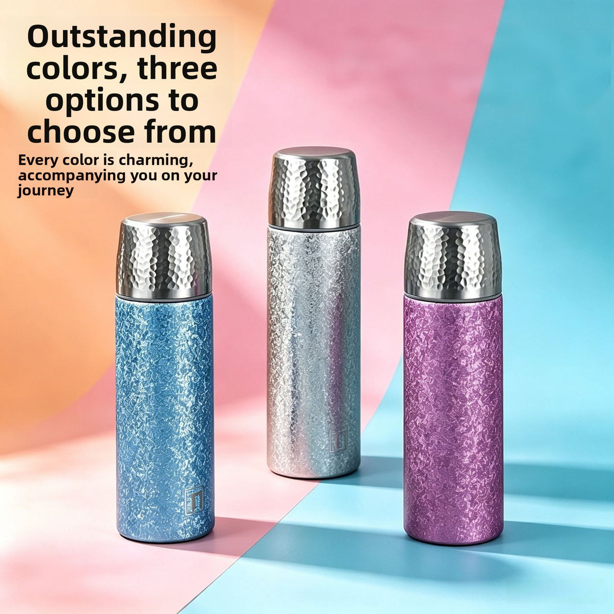 Three titanium coated insulated travel mugs in glacier blue, space silver and starry purple with hammered caps
