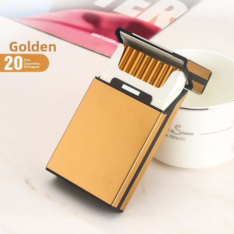 Gold aluminum cigarette case with flip top open over a row of 20 slim cigarettes
