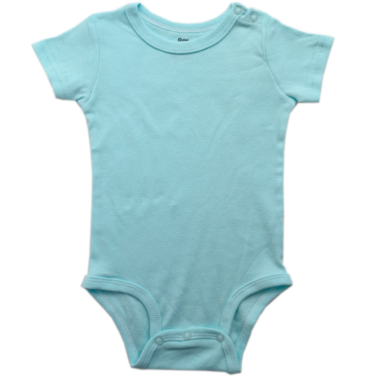 Folded baby short sleeve cotton bodysuit with shoulder snap shoulders on a plain background