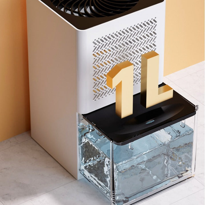 Close view of the dehumidifier slotted grille and clear water tank with a 1L label, filled with water