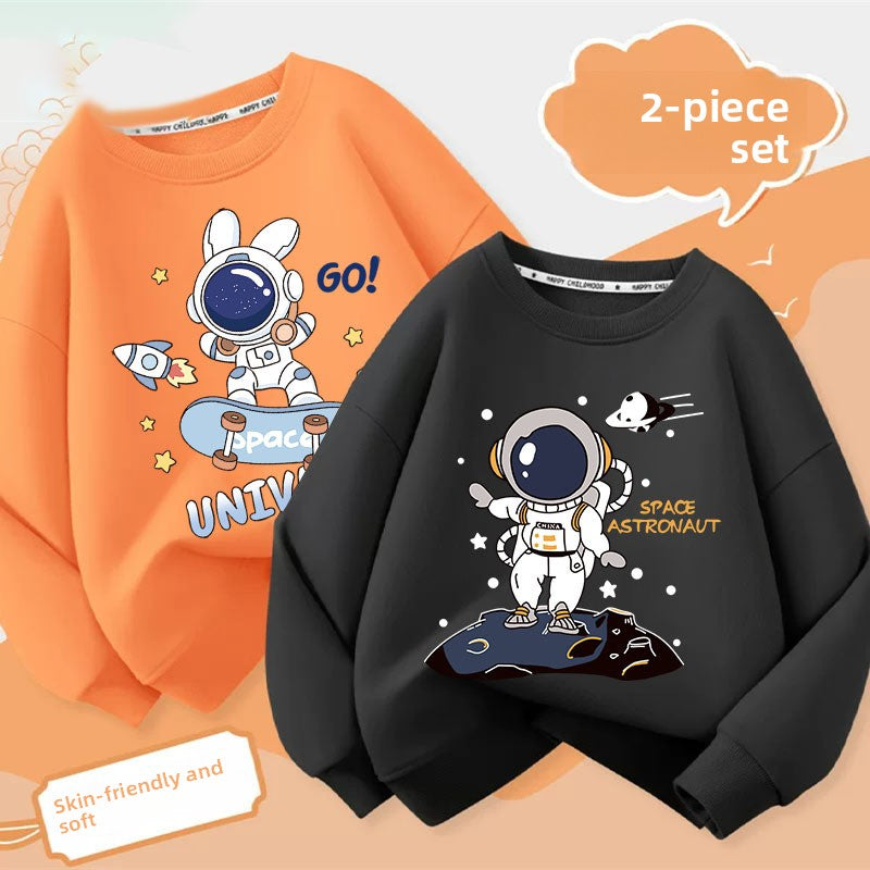 Boys orange crew neck sweatshirt with a skateboarding bear front graphic shown on a plain background