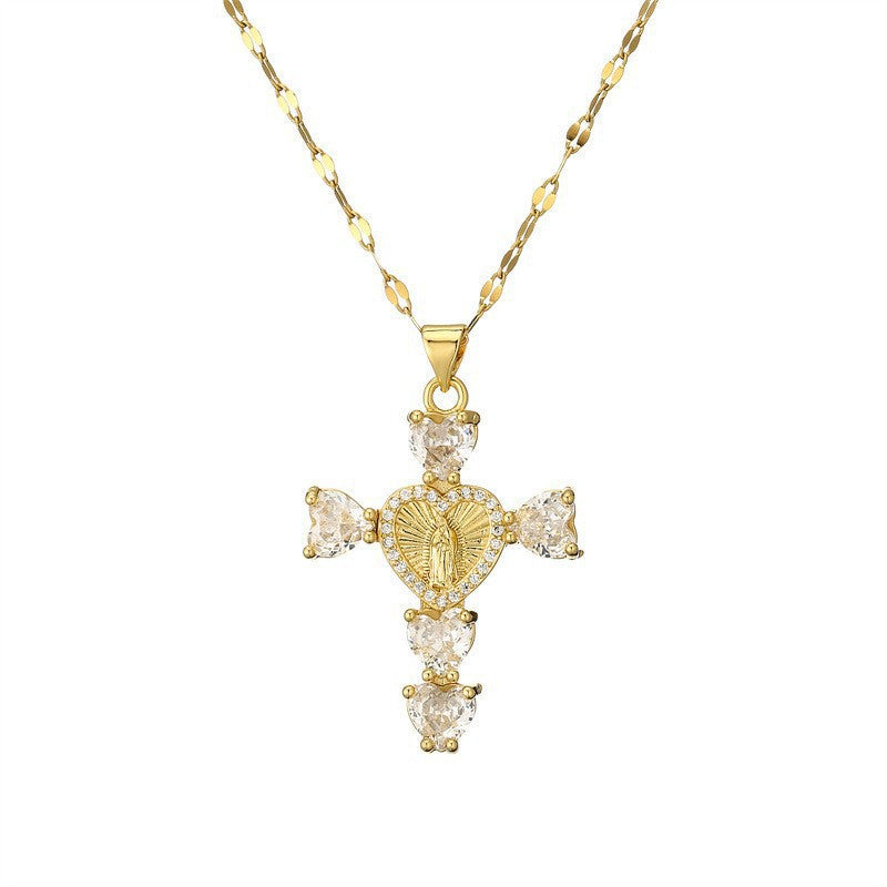 Paved cubic zirconia cross pendant necklace laid flat on a light background