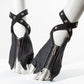 Pair of black satin coated half finger gloves with metal zip and crossed eyelet wrist strap on mannequin hands