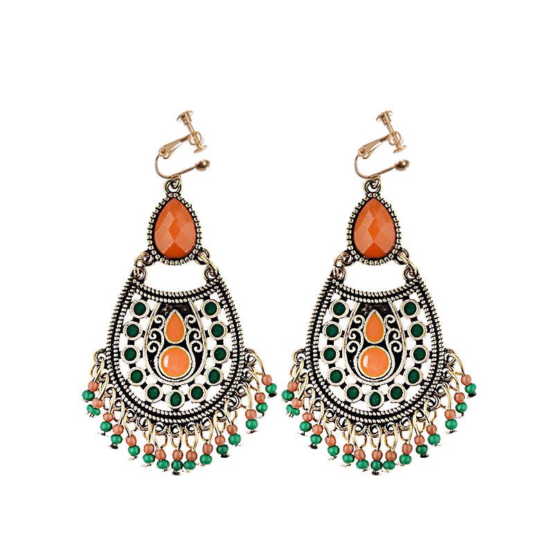 Vintage boho tassel clip-on earrings for non pierced ears, zinc alloy drop pair photographed on white background