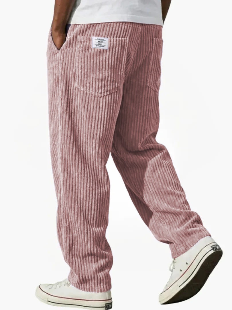 Corduroy trousers worn with a plain tee to show the relaxed straight leg cut