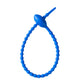 Soft silicone tadpole cable tie coiled into a loop to show the reusable cinch closure