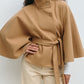 Short cape jacket with cape cut sleeves and a matching self tie belt at the waist