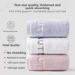 Embroidered 100 percent cotton hand towel with a thick pile and tone on tone letters