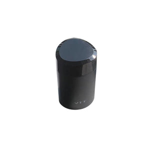 Capped black VTT pocket electric shaver standing upright, matte metal barrel