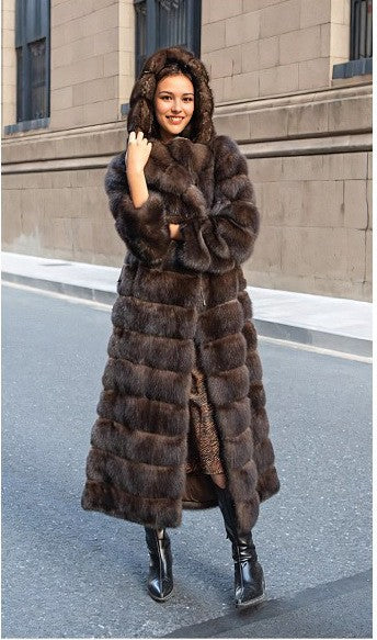 Long brown hooded vegan fur coat, option photo for size M, worn with black boots