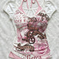 Front flat lay of a slim white short sleeve tee with a pink halter panel and print