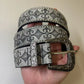 Rows of metal studs framing the embossed grey strap of the western belt