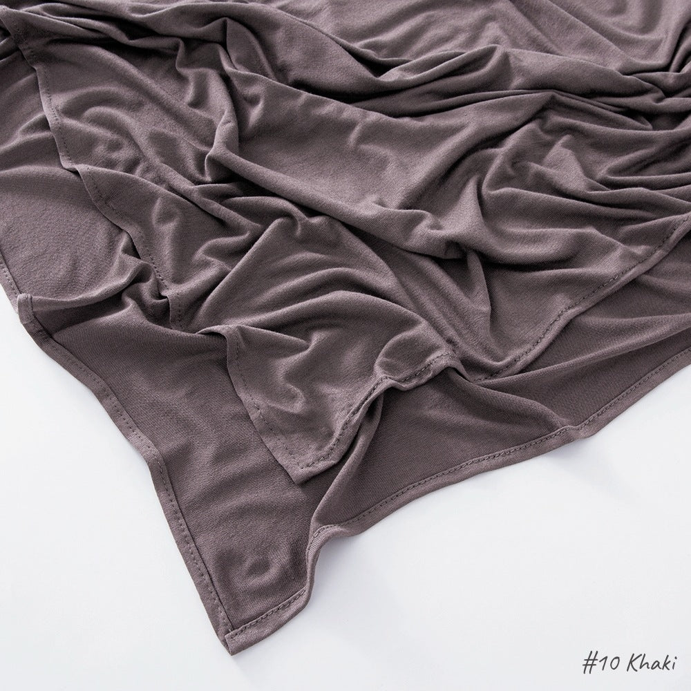 Flat lay of the soft modal cotton scarf wrap showing the even weave and finished border edge