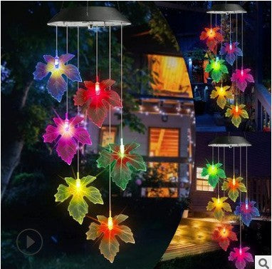 Maple leaf LED figures glowing in several colors, hanging from a solar lamp head, red housing option
